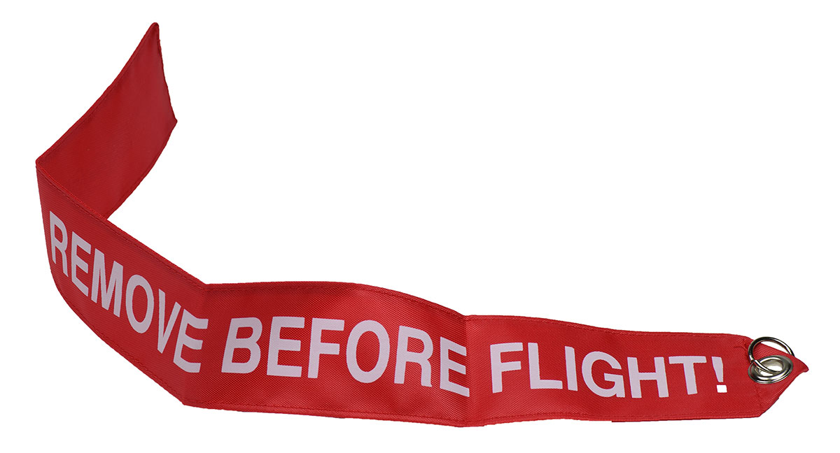 Remove before flight sign on an aircraft, Red remove before flight